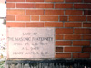 This cornerstone of the John Baker White Hall was located in the courtyard portion of the building. The stone was spared from demolition in 2004 and is still visible as part of the present Rahall Technology Center building.